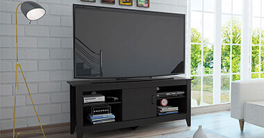 Mueble de color negro con televisin encima